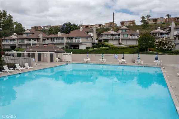 a view of houses with outdoor space and swimming pool