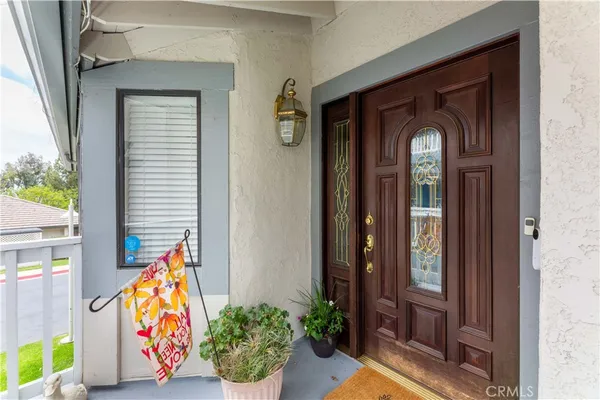 a view of front door with wooden door