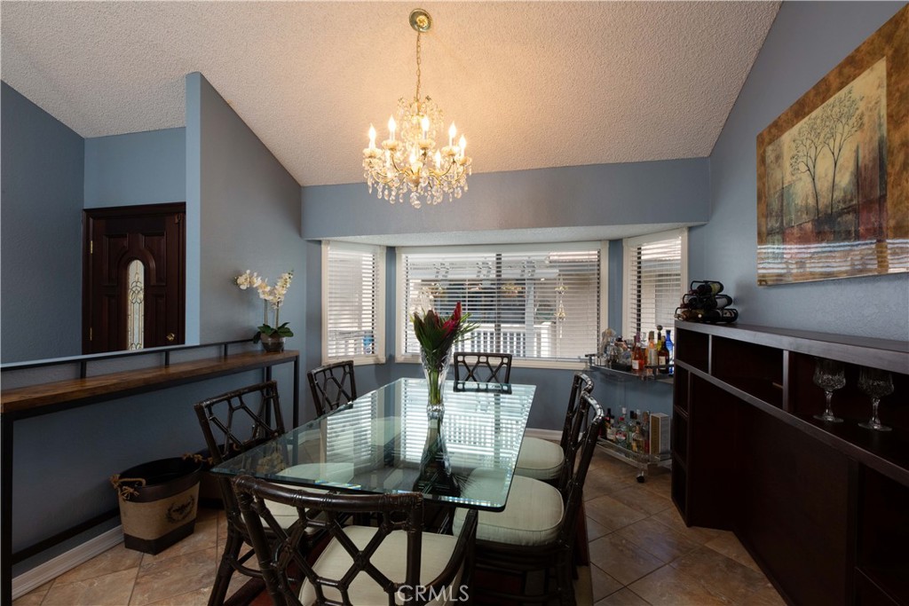2583 Sandpebble Lane Brea, CA 92821 - Photo 6 of 27 a view of a dining room with furniture and chandelier