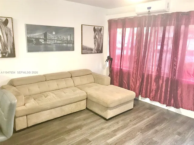 a living room with a bed and a couch