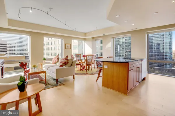 a kitchen with stainless steel appliances granite countertop a stove and cabinets