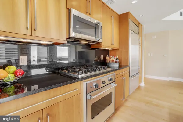 a kitchen that has a sink and a stove