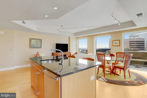 a kitchen with cabinets a sink and appliances