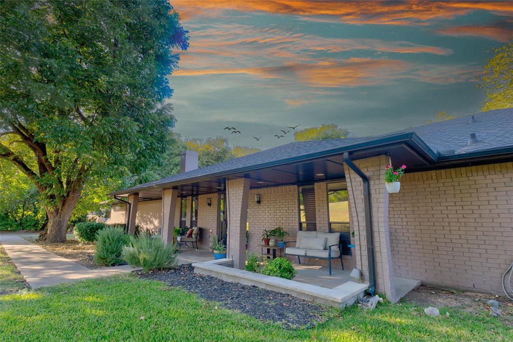 175 East Pleasant Run Road Cedar Hill, TX 75104 - Photo 1 of 39 a front view of a house with garden