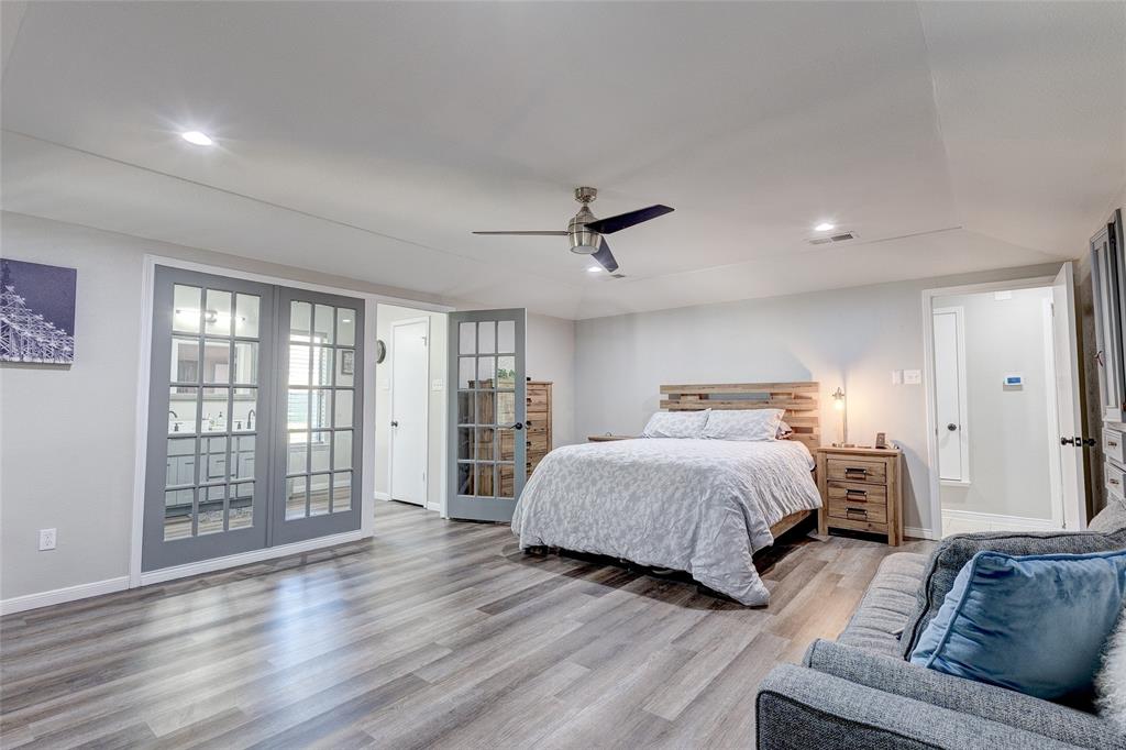 175 East Pleasant Run Road Cedar Hill, TX 75104 - Photo 17 of 39 a spacious bedroom with a bed couch and a window