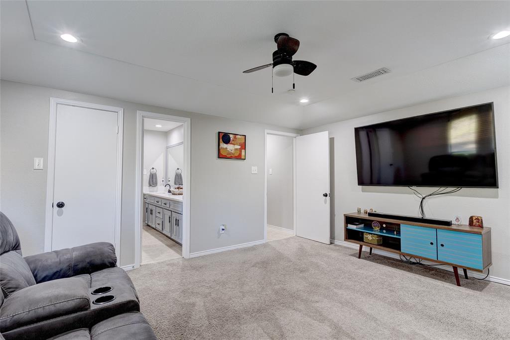 175 East Pleasant Run Road Cedar Hill, TX 75104 - Photo 19 of 39 a living room with furniture and a flat screen tv