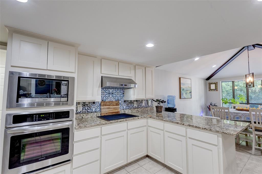 175 East Pleasant Run Road Cedar Hill, TX 75104 - Photo 25 of 39 a kitchen with appliances a sink cabinets and a window