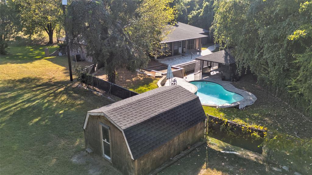 175 East Pleasant Run Road Cedar Hill, TX 75104 - Photo 7 of 39 a view of a terrace with a table and chairs under an umbrella
