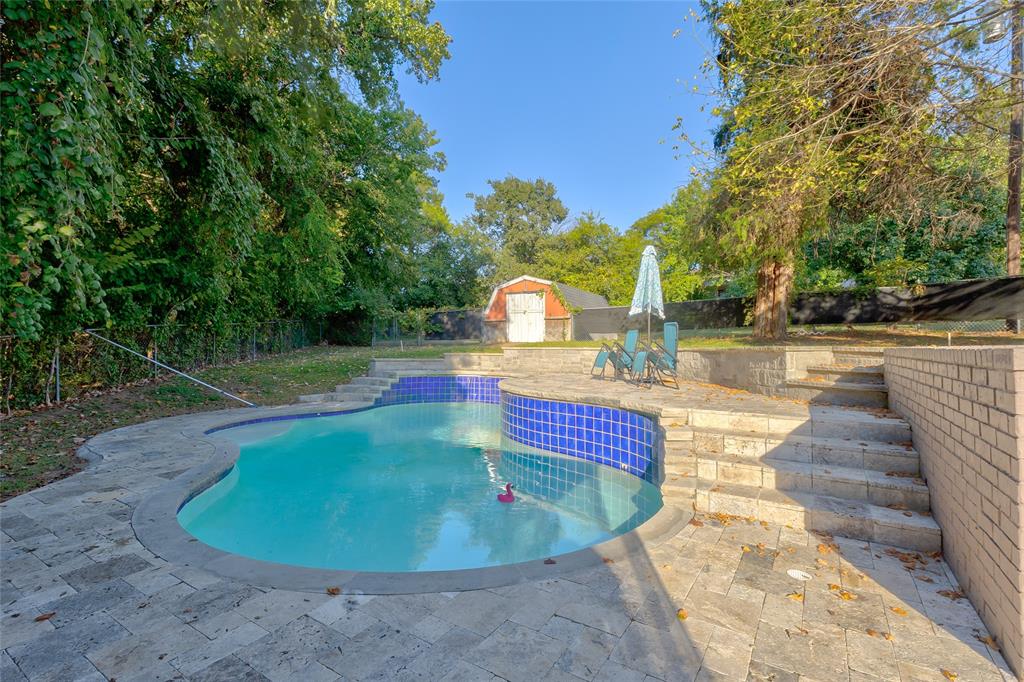 175 East Pleasant Run Road Cedar Hill, TX 75104 - Photo 10 of 39 a view of a swimming pool with a patio