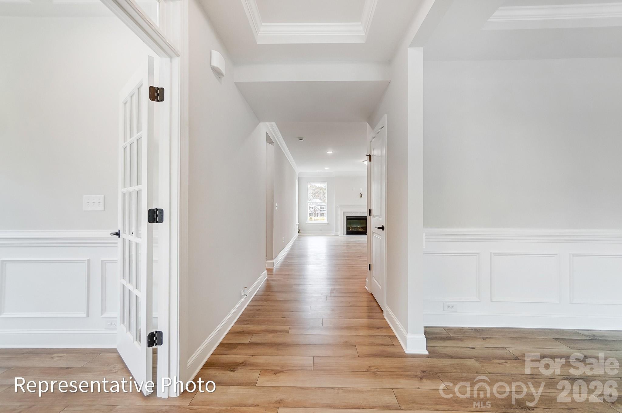 5058 Mclaughlin Loop Waxhaw, NC 28173 - Photo 11 of 42 a view of a hallway with wooden floor and staircase