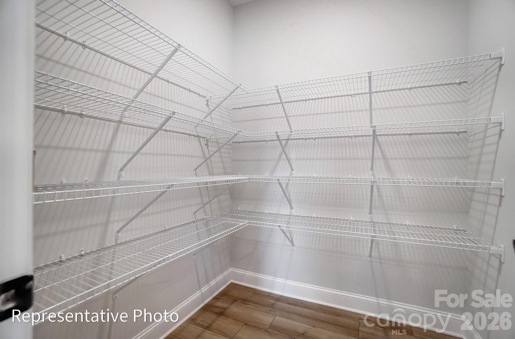 5058 Mclaughlin Loop Waxhaw, NC 28173 - Photo 24 of 42 a view of a room with racks on the wall