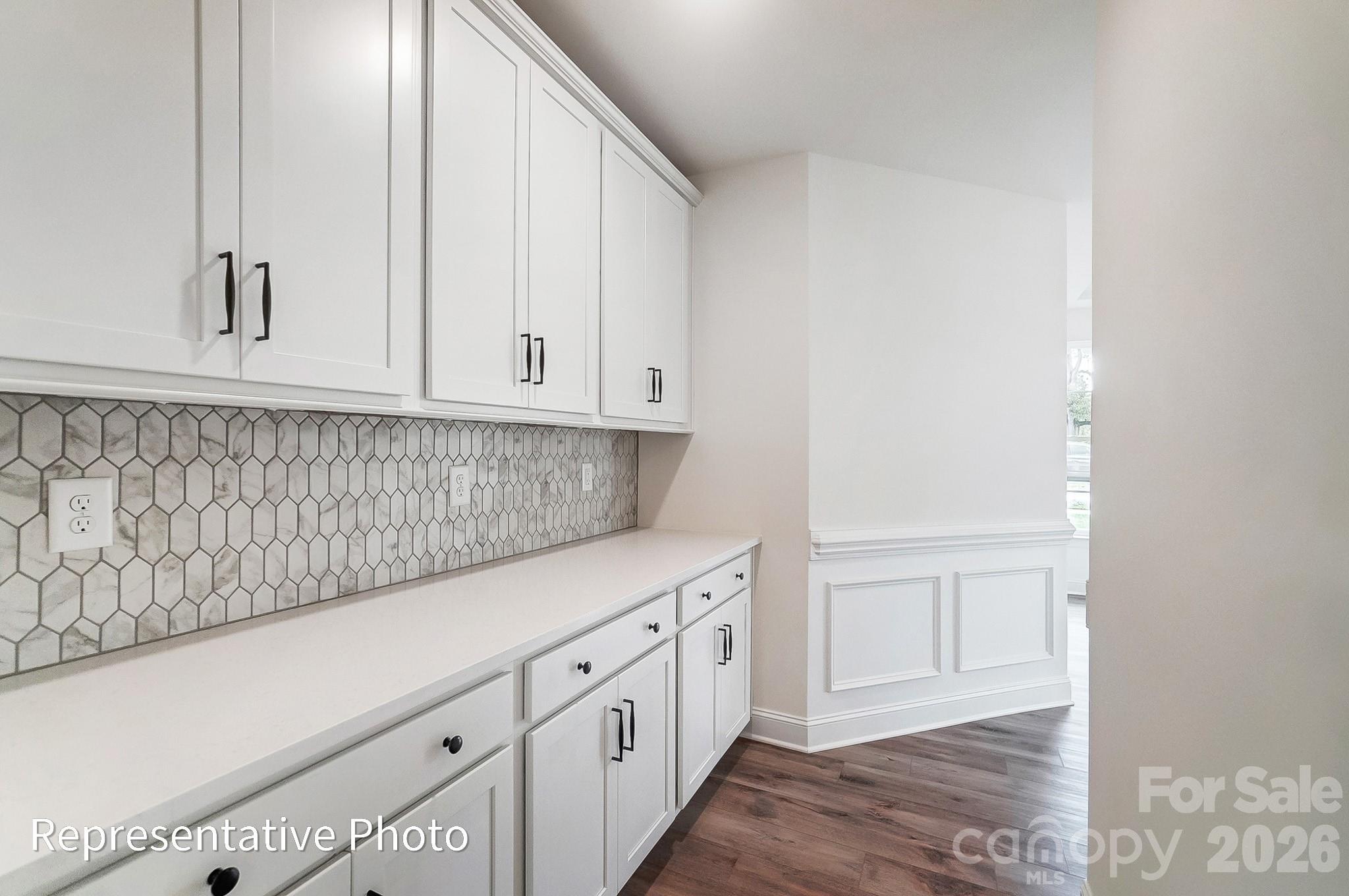 5058 Mclaughlin Loop Waxhaw, NC 28173 - Photo 25 of 42 a view of cabinets with wooden floor