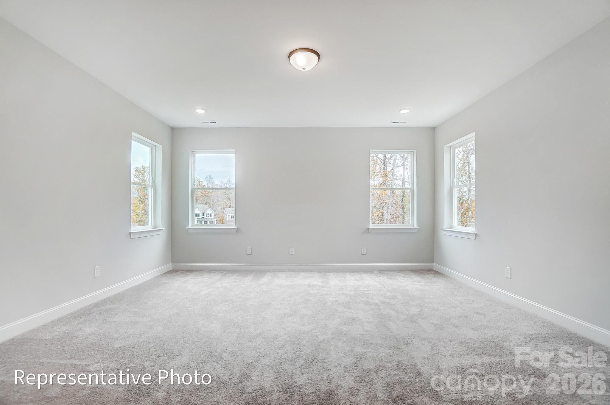 5058 Mclaughlin Loop Waxhaw, NC 28173 - Photo 29 of 42 a view of an empty room with a window