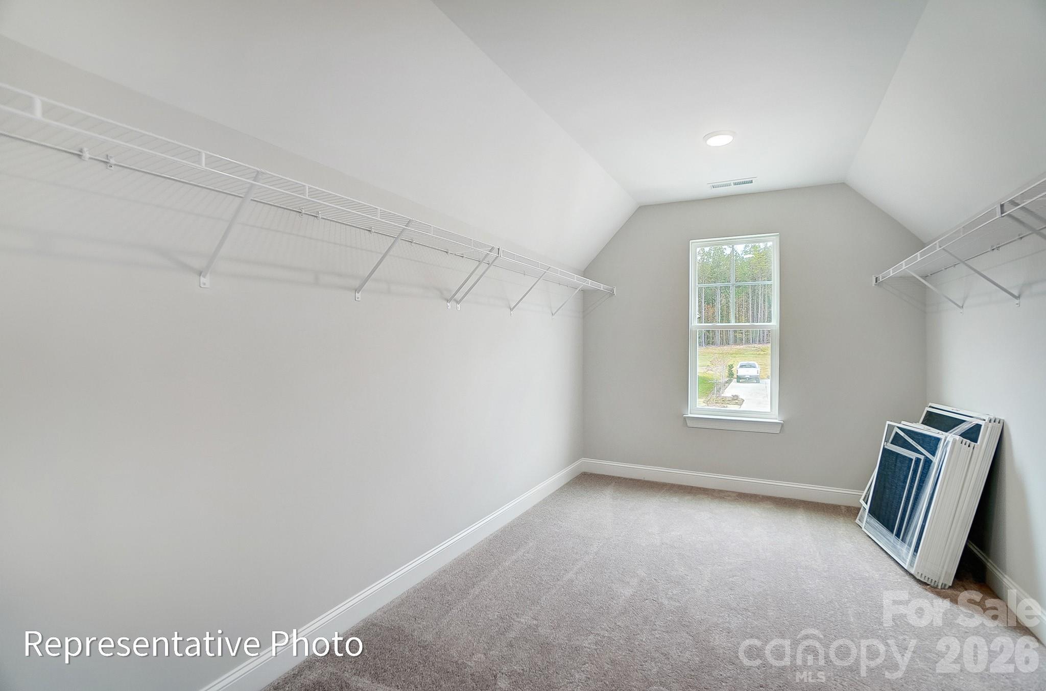 5058 Mclaughlin Loop Waxhaw, NC 28173 - Photo 33 of 42 an empty room with windows
