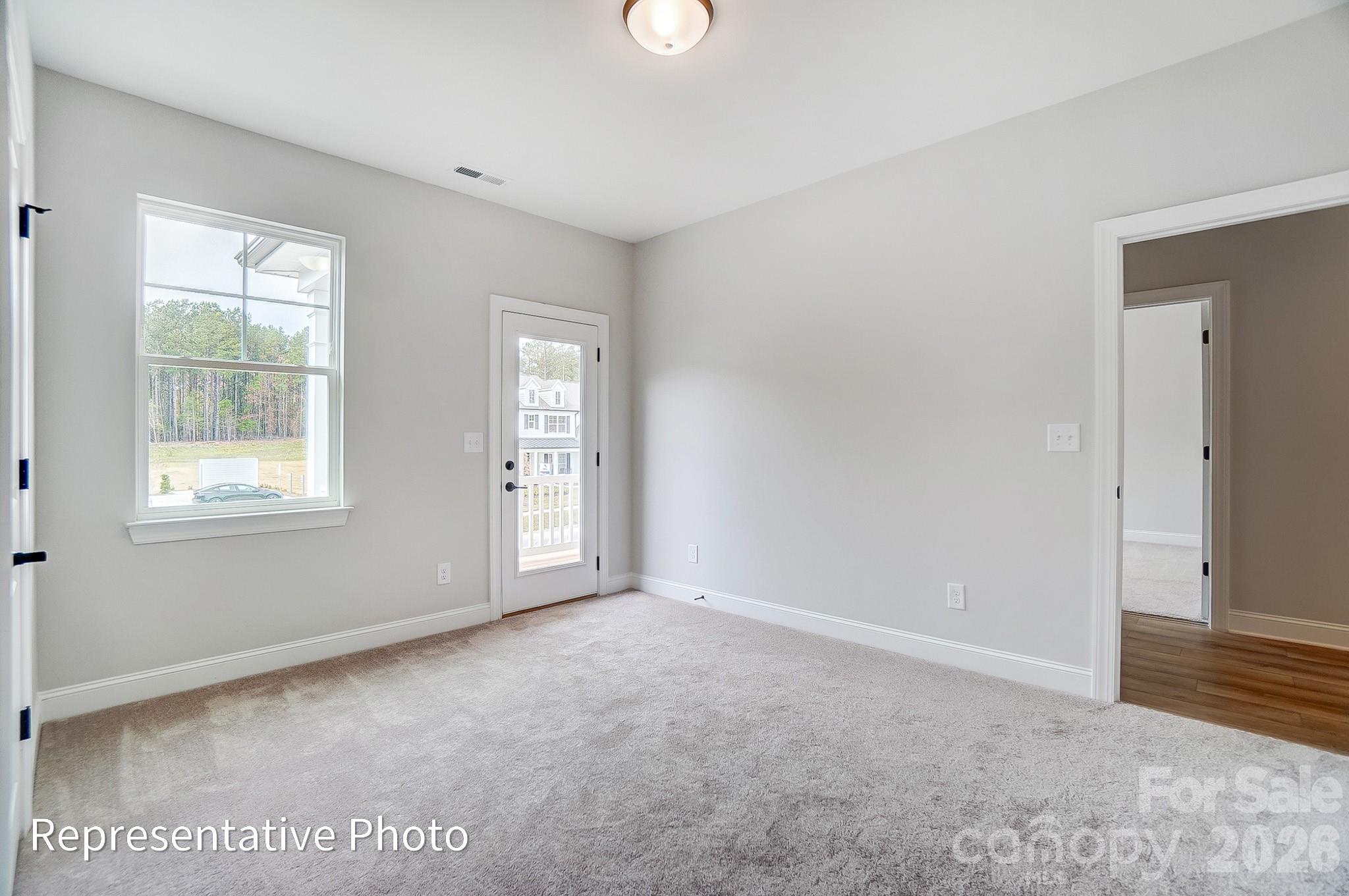 5058 Mclaughlin Loop Waxhaw, NC 28173 - Photo 35 of 42 a view of an empty room with a window