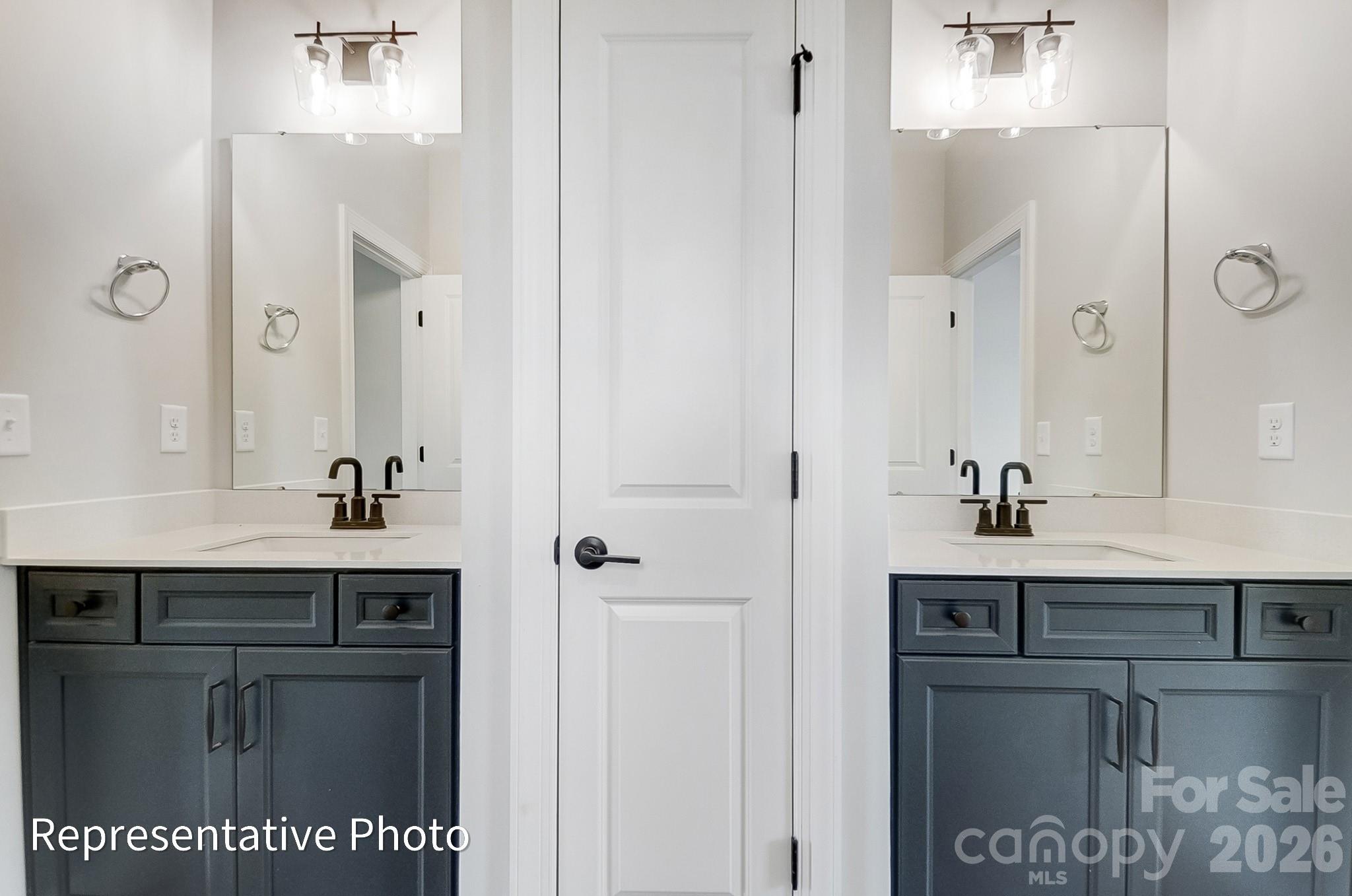 5058 Mclaughlin Loop Waxhaw, NC 28173 - Photo 38 of 42 a bathroom with a sink and a mirror
