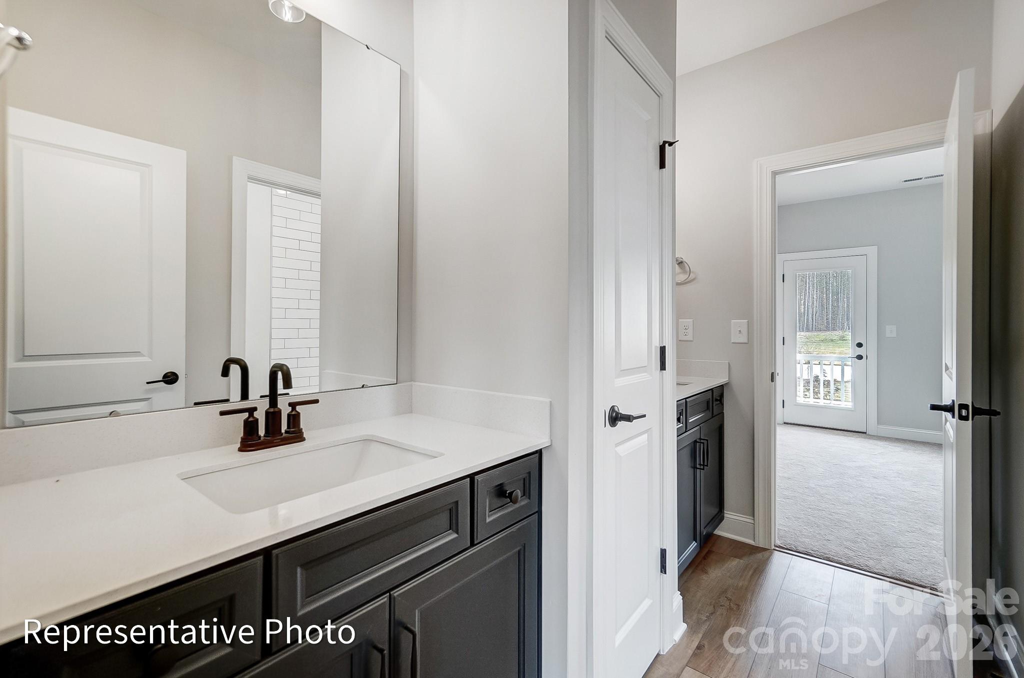 5058 Mclaughlin Loop Waxhaw, NC 28173 - Photo 39 of 42 a kitchen with a sink and a refrigerator