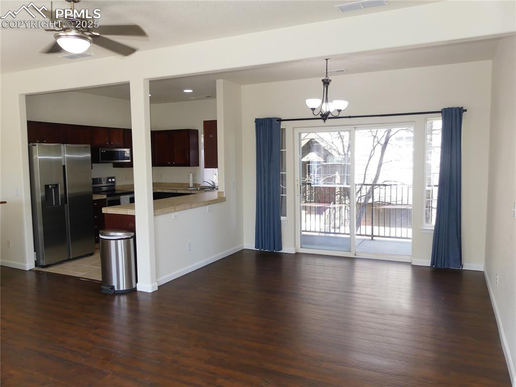 1054 Kara Ridge Point Colorado Springs, CO 80907 - Photo 11 of 33 Dining area w/ a walk-out to the covered balcony area