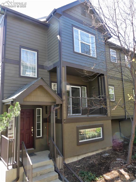 1054 Kara Ridge Point Colorado Springs, CO 80907 - Photo 2 of 33 View of front of house with a balcony