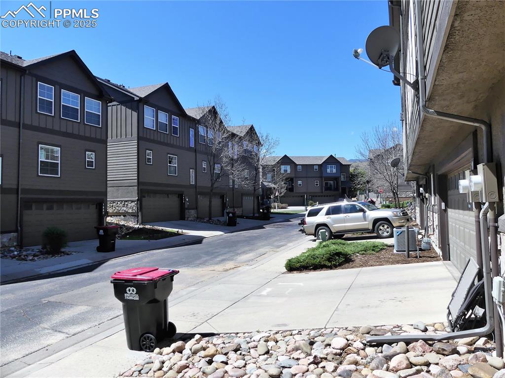 1054 Kara Ridge Point Colorado Springs, CO 80907 - Photo 30 of 33 View of road with sidewalks and a residential view
