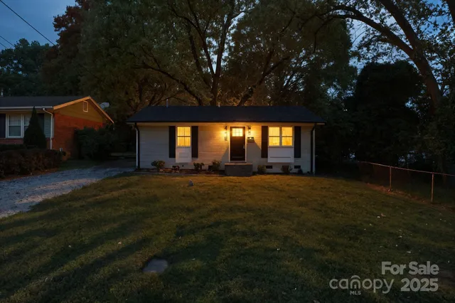 a front view of house with yard and green space