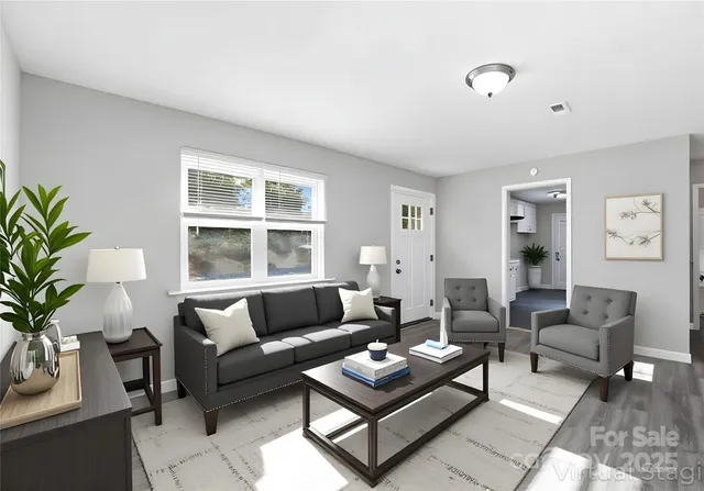 a living room with furniture and a large window