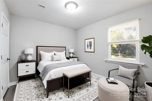 a bedroom with bed and window