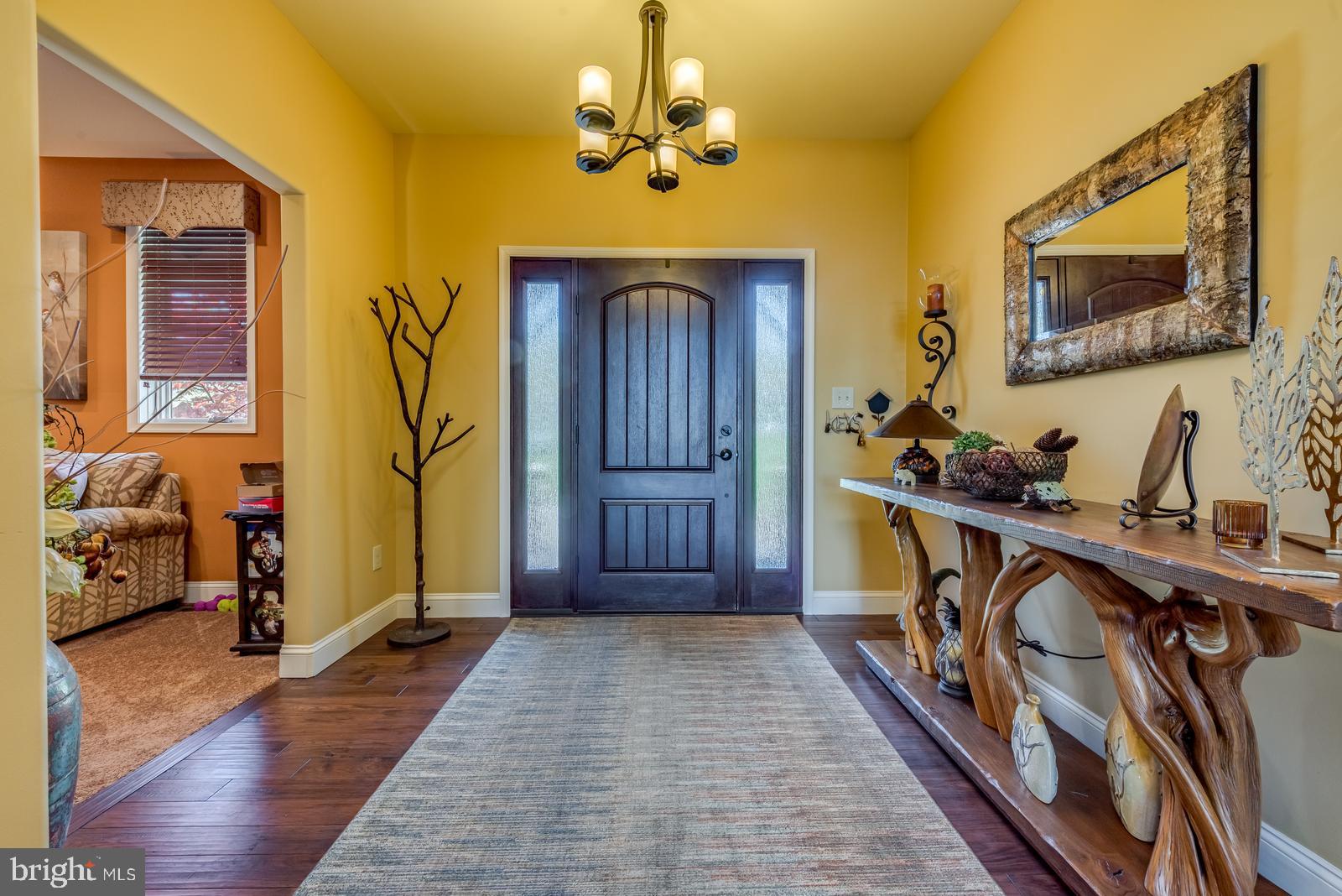 968 Scots Pne Lane Hazleton, PA 18202 - Photo 11 of 95 a view of a hallway with wooden floor and staircase