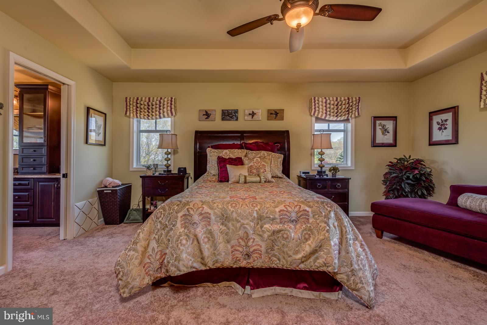 968 Scots Pne Lane Hazleton, PA 18202 - Photo 36 of 95 a bedroom with a large bed and a chandelier