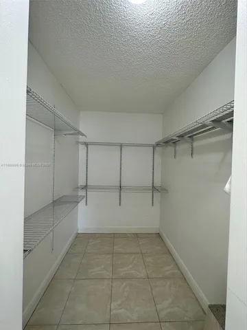 a view of a hallway with closet