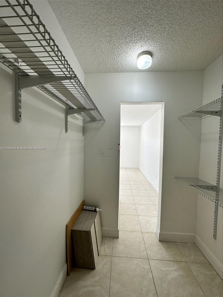 6214 Southwest 131st Court, Unit 201 Miami, FL 33183 - Photo 18 of 18 a view of a hallway with closet