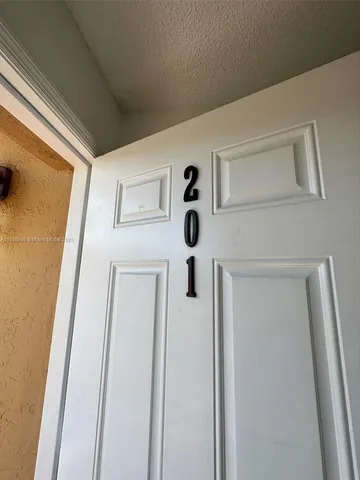 a view of a hallway with door