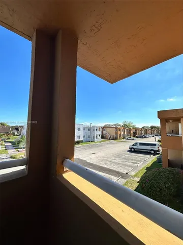 a view of a city street from a balcony