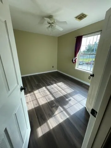 a view of an empty room with a window