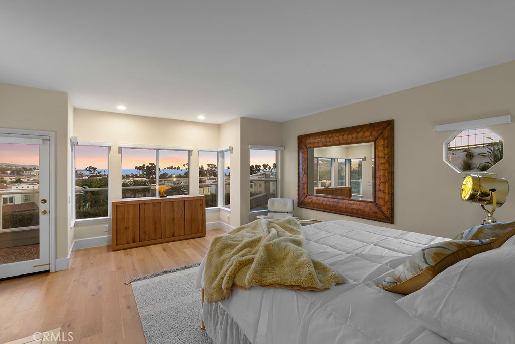 25352 Village Dana Point Dana Point, CA 92629 - Photo 21 of 41 a bedroom with a large bed and a view of kitchen