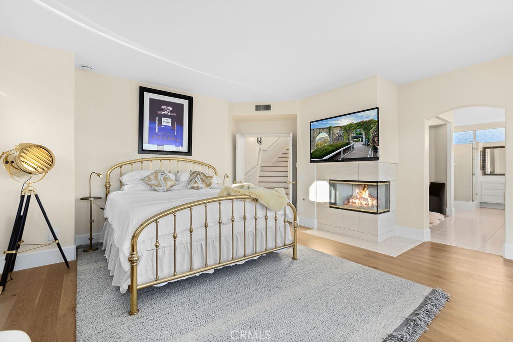 25352 Village Dana Point Dana Point, CA 92629 - Photo 23 of 41 a bedroom with a bed and a flat screen tv