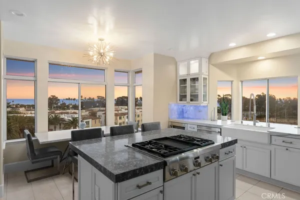 a kitchen that has a sink and a stove