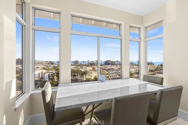a view of a living room with furniture and a window
