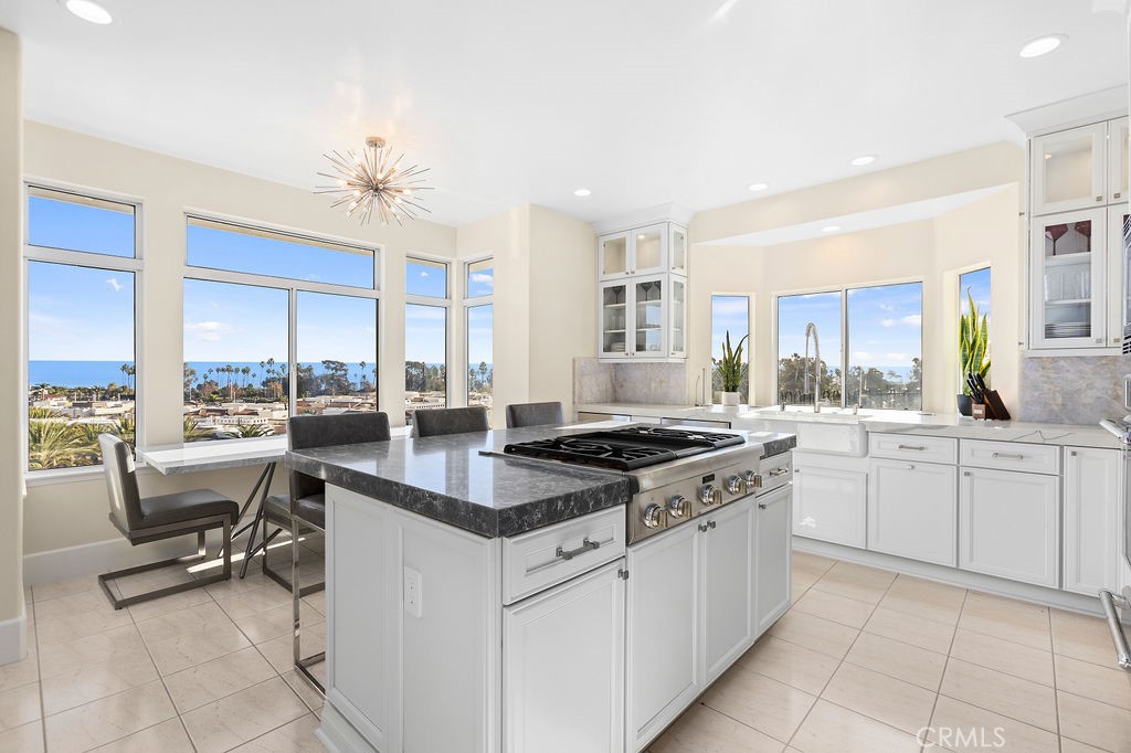 25352 Village Dana Point Dana Point, CA 92629 - Photo 10 of 41 a kitchen with cabinets and chairs