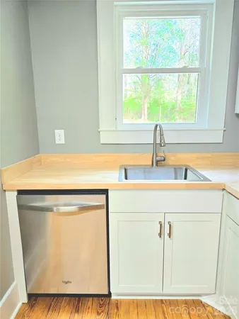 a bathroom with a sink and a window