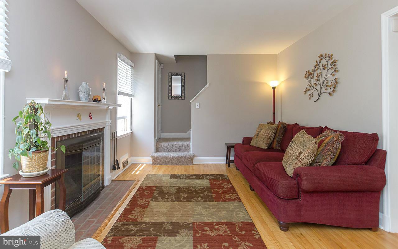 810 Olmstead Road Pikesville, MD 21208 - Photo 2 of 30 a living room with furniture and a fireplace