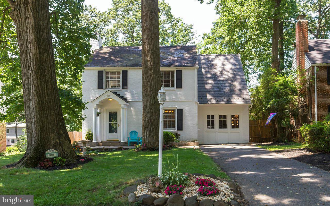 810 Olmstead Road Pikesville, MD 21208 - Photo 11 of 30 a front view of a house with a garden