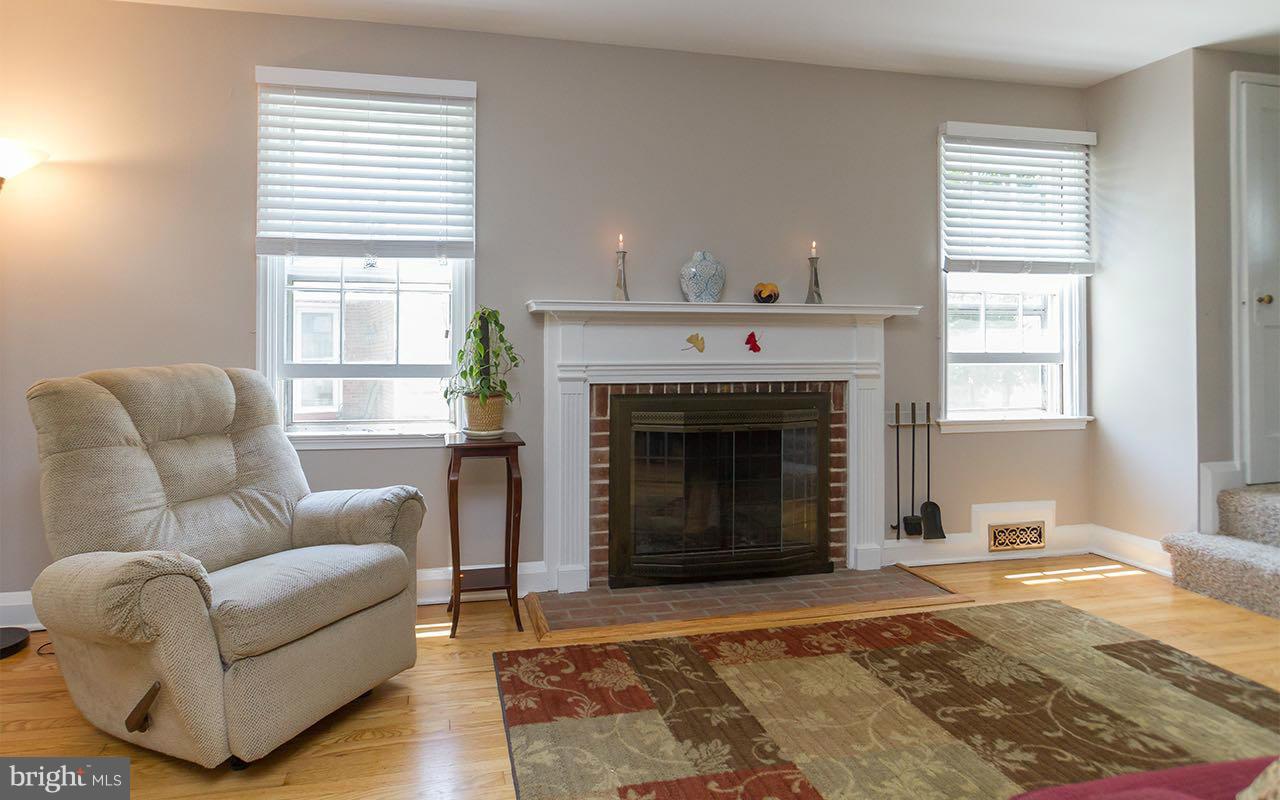 810 Olmstead Road Pikesville, MD 21208 - Photo 13 of 30 a living room with furniture and a fireplace