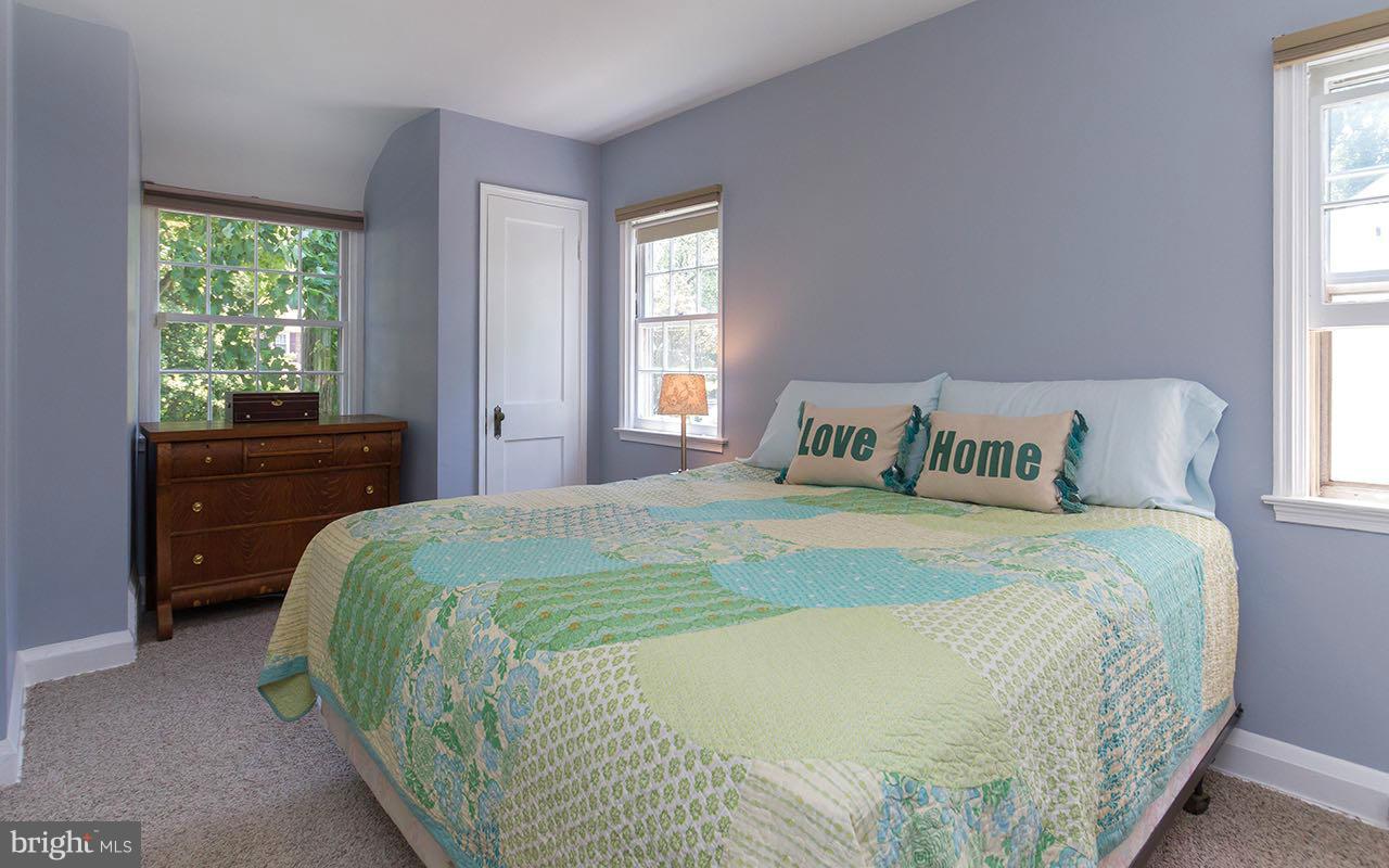 810 Olmstead Road Pikesville, MD 21208 - Photo 20 of 30 a bedroom with a bed and window