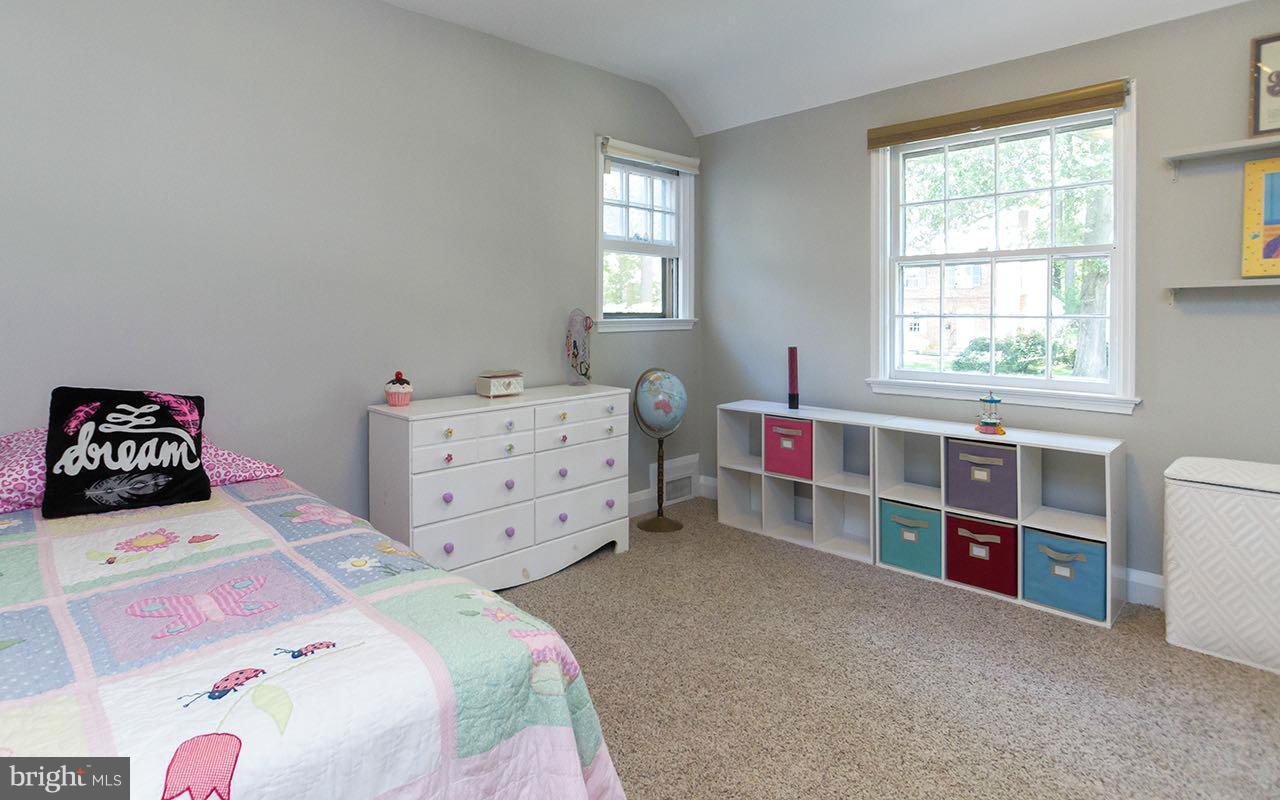810 Olmstead Road Pikesville, MD 21208 - Photo 21 of 30 a bedroom with a bed and a window