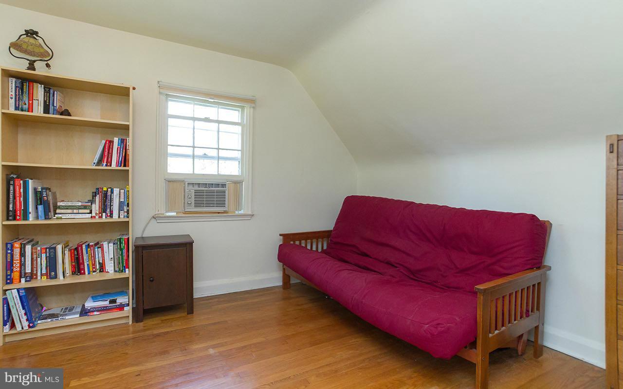 810 Olmstead Road Pikesville, MD 21208 - Photo 25 of 30 a living room with furniture and a book shelf
