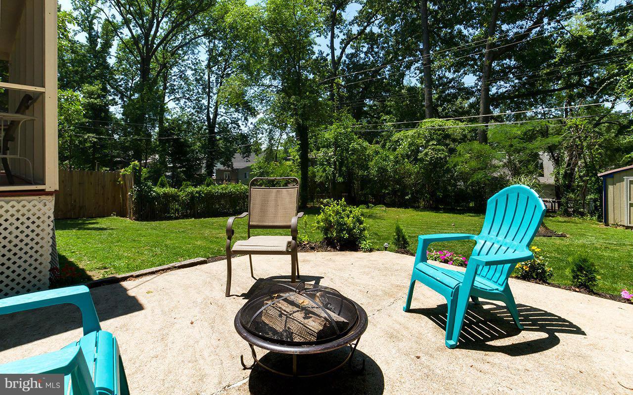 810 Olmstead Road Pikesville, MD 21208 - Photo 27 of 30 a view of a table and chairs in back yard