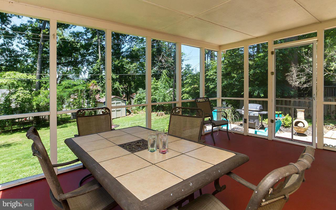 810 Olmstead Road Pikesville, MD 21208 - Photo 4 of 30 a view of a dining table and chairs in the patio