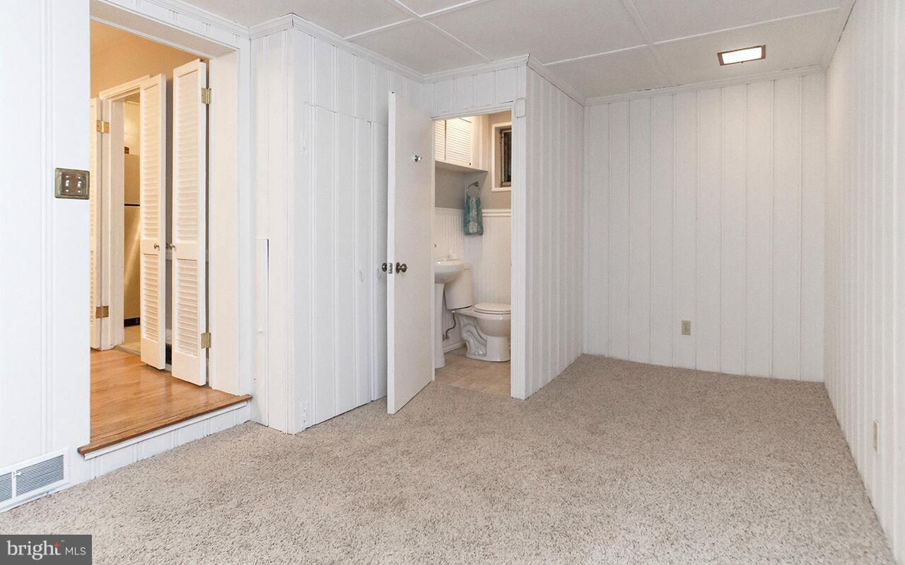 810 Olmstead Road Pikesville, MD 21208 - Photo 7 of 30 a view of an empty room with a bathroom
