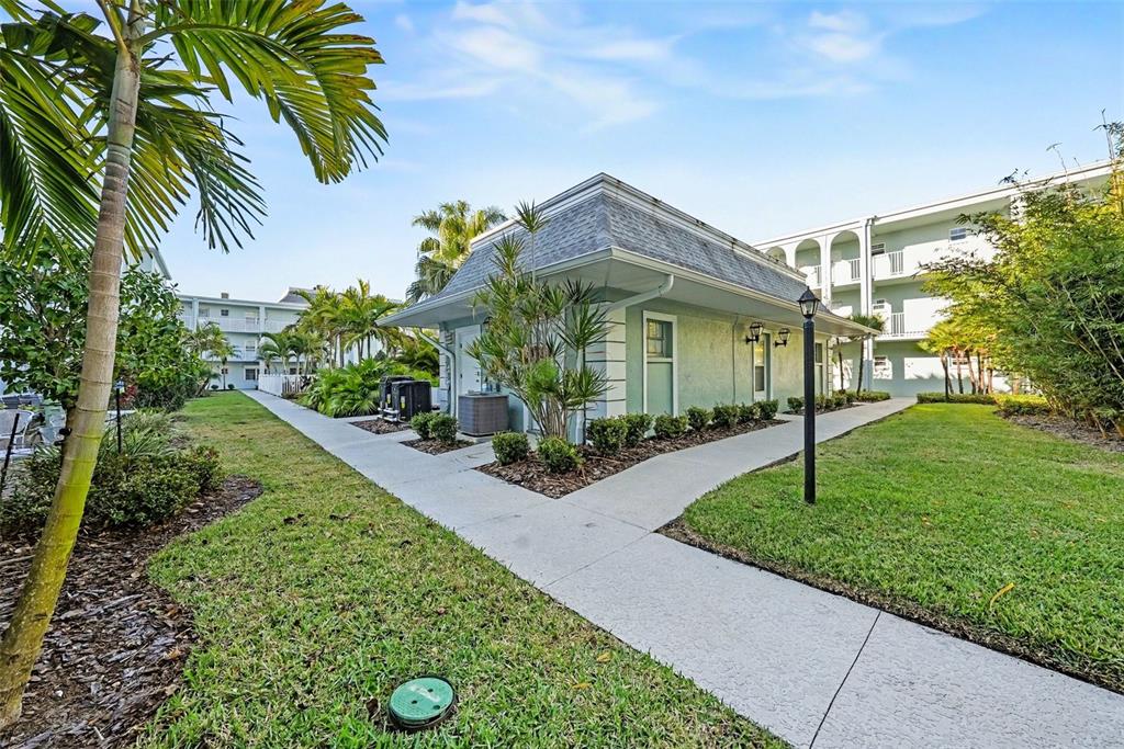 701 Poinsettia Road, Unit 240 Belleair, FL 33756 - Photo 22 of 30 a front view of a house with a yard